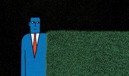 man next to hedge